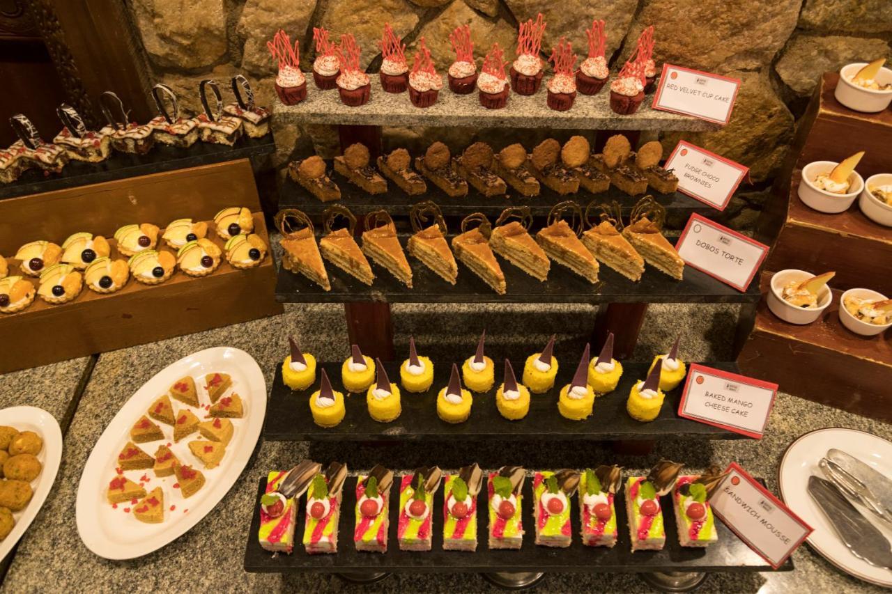 Heritage Madurai Exterior photo A selection of desserts
